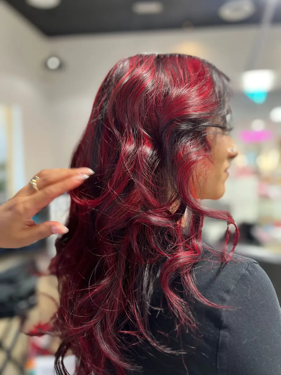 A deep ruby red styled into loose waves